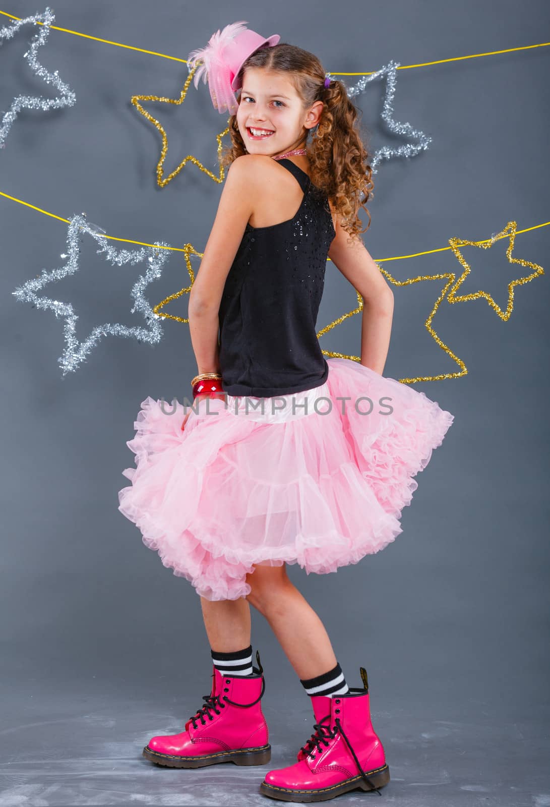 Fashion girl is wearing masquerade costume. Holiday theme/Emotion child.