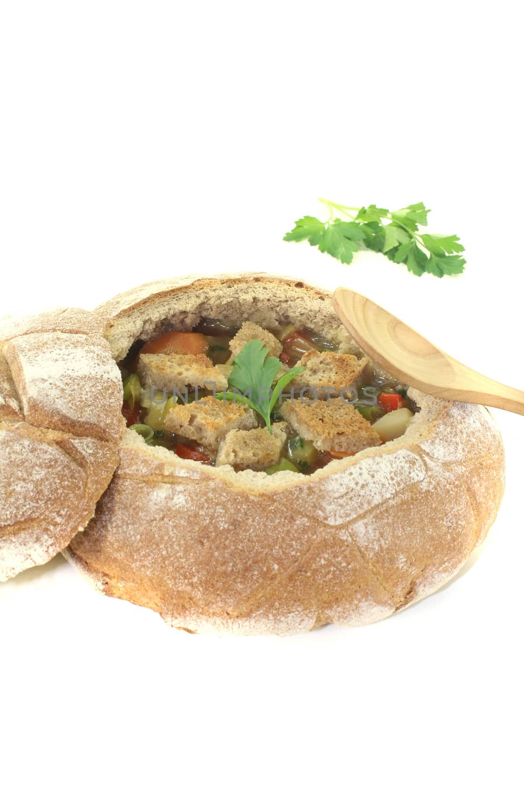 Bread soup with croutons on a light background