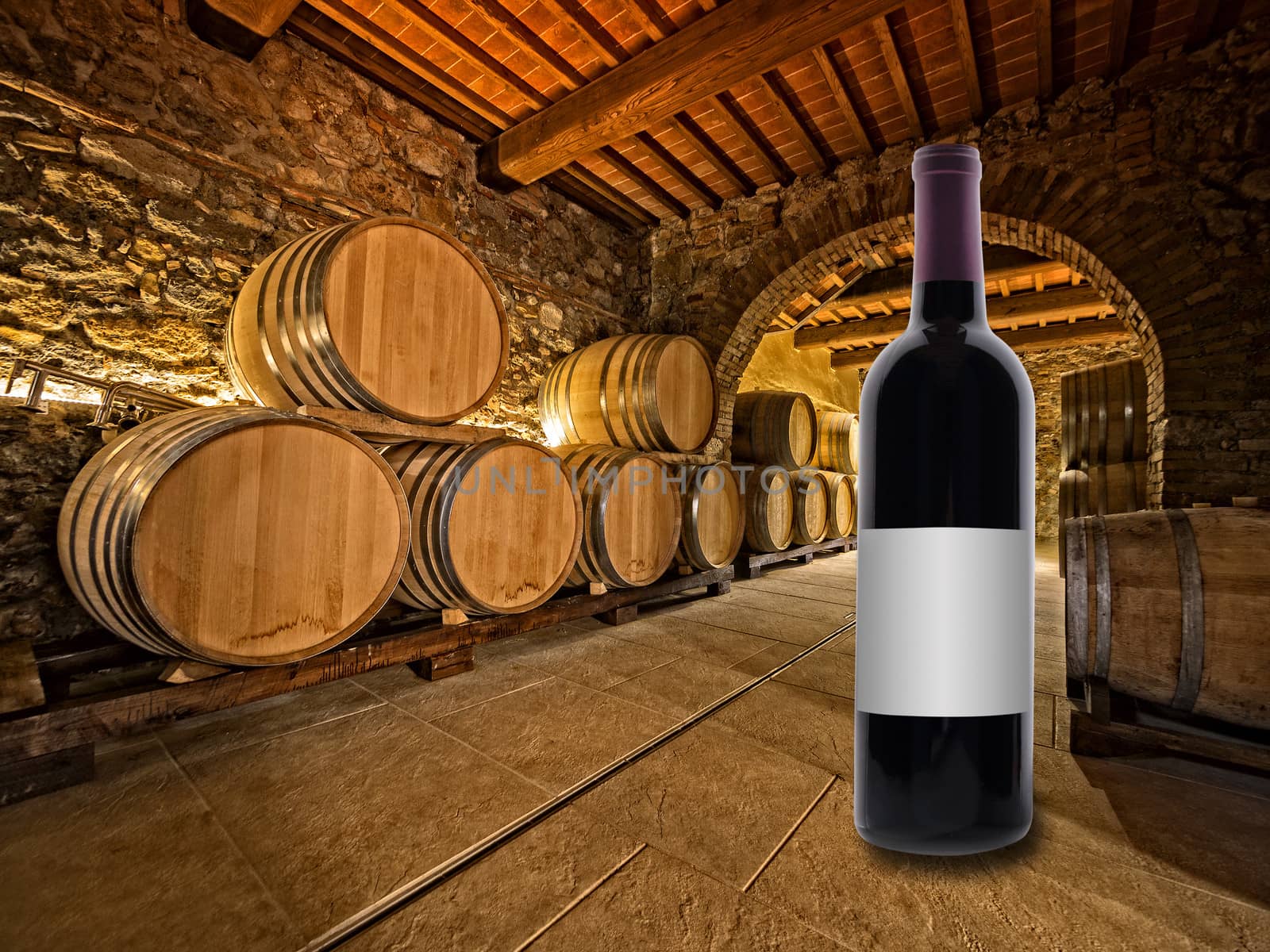 red wine bottle on the floor of a winery