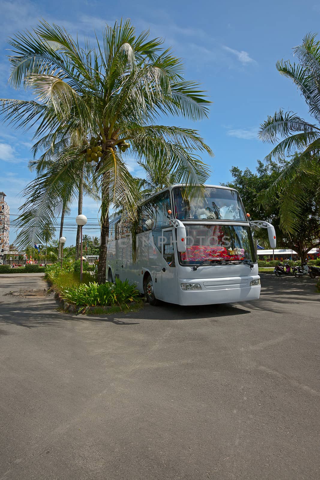 Tourist bus parked on  background of blue sky, Thailand.