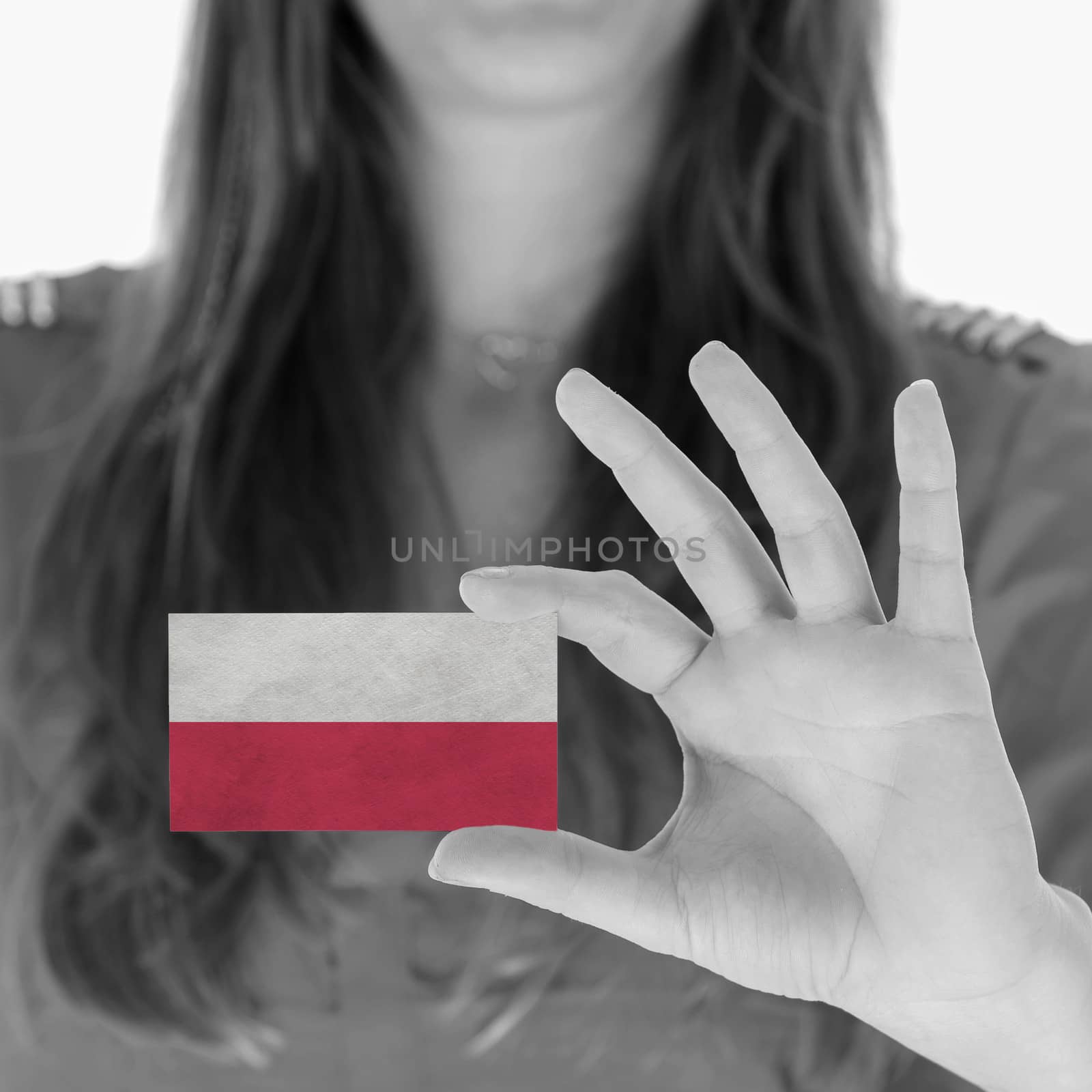 Woman in showing a business card, Poland