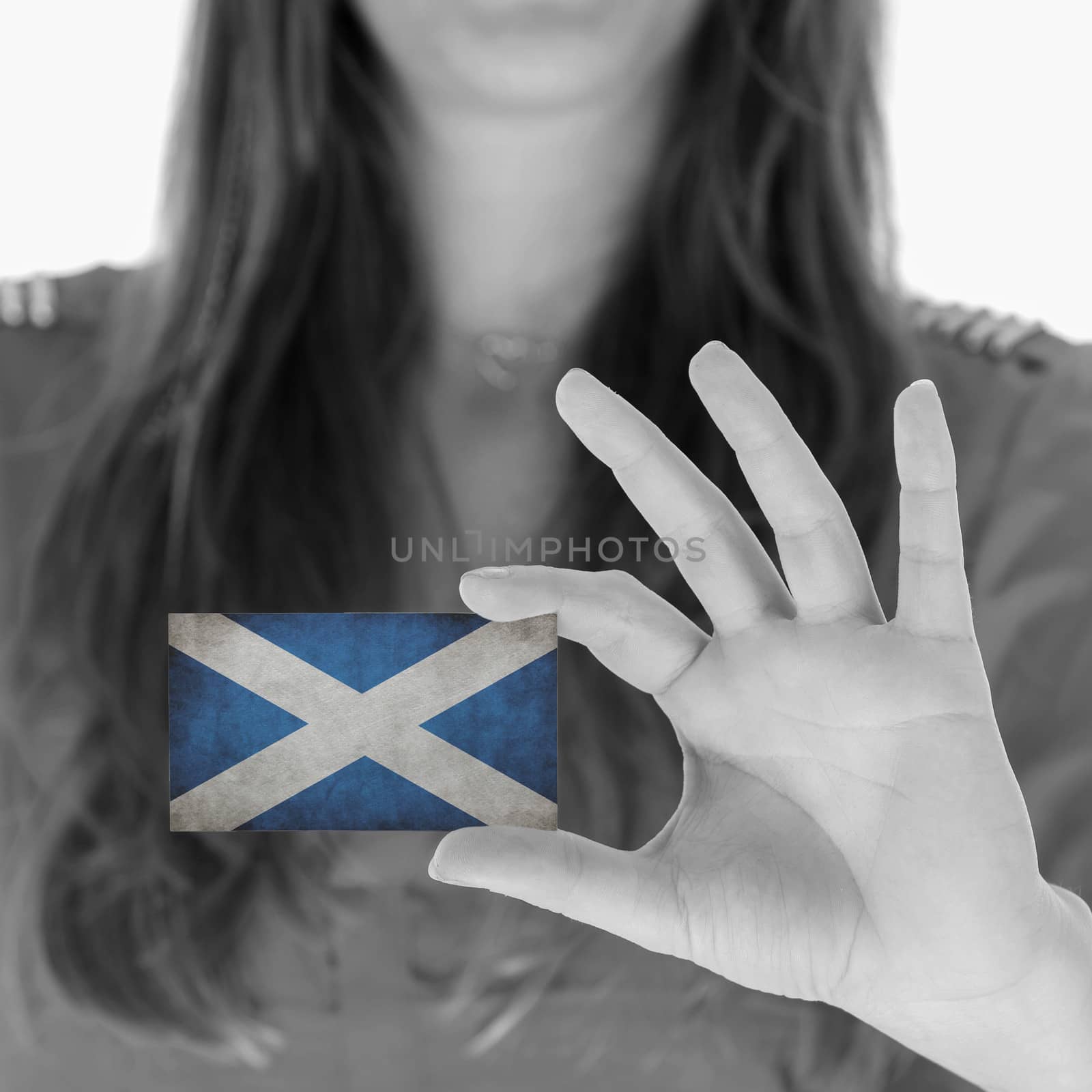 Woman in showing a business card, Scotland