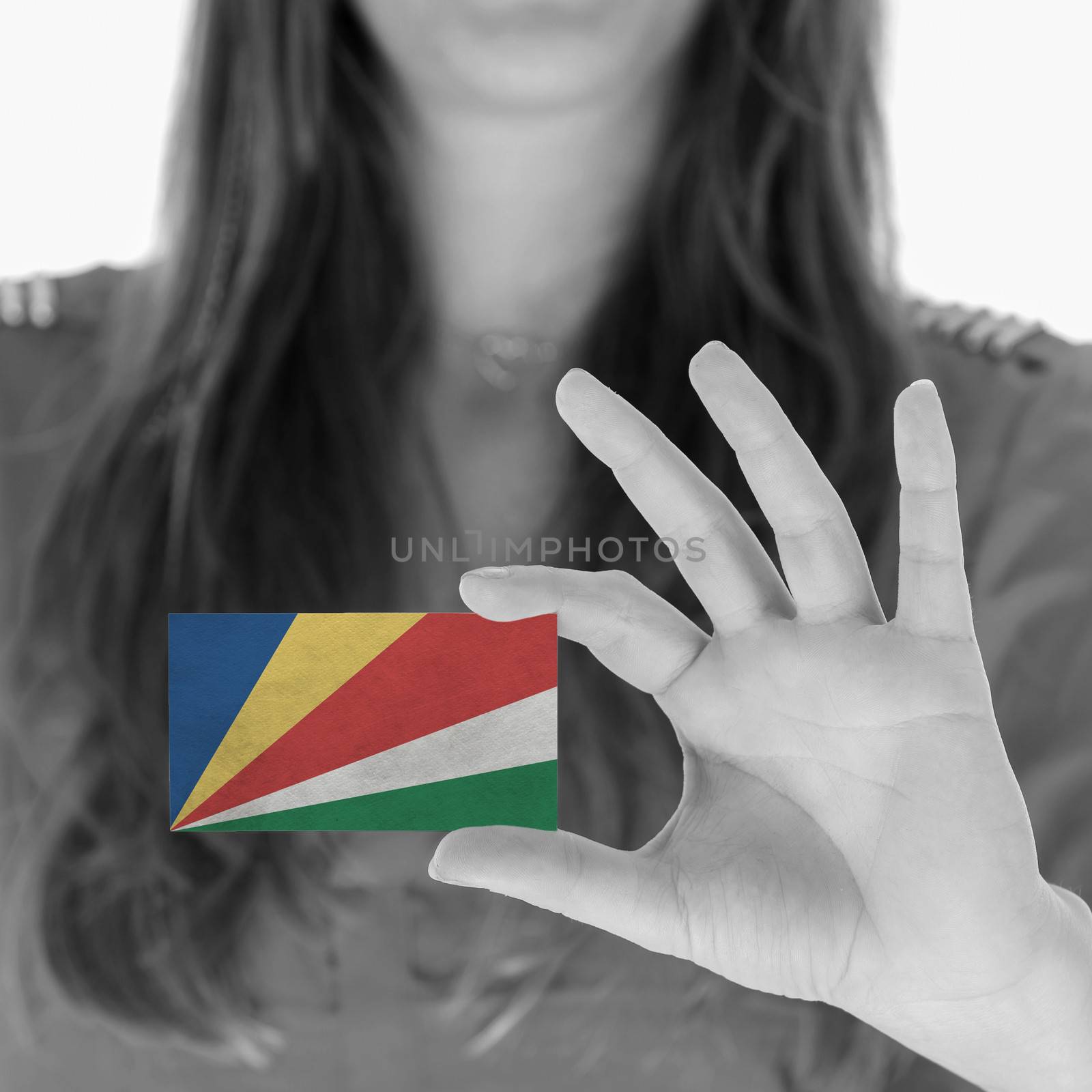 Woman in showing a business card, Seychelles