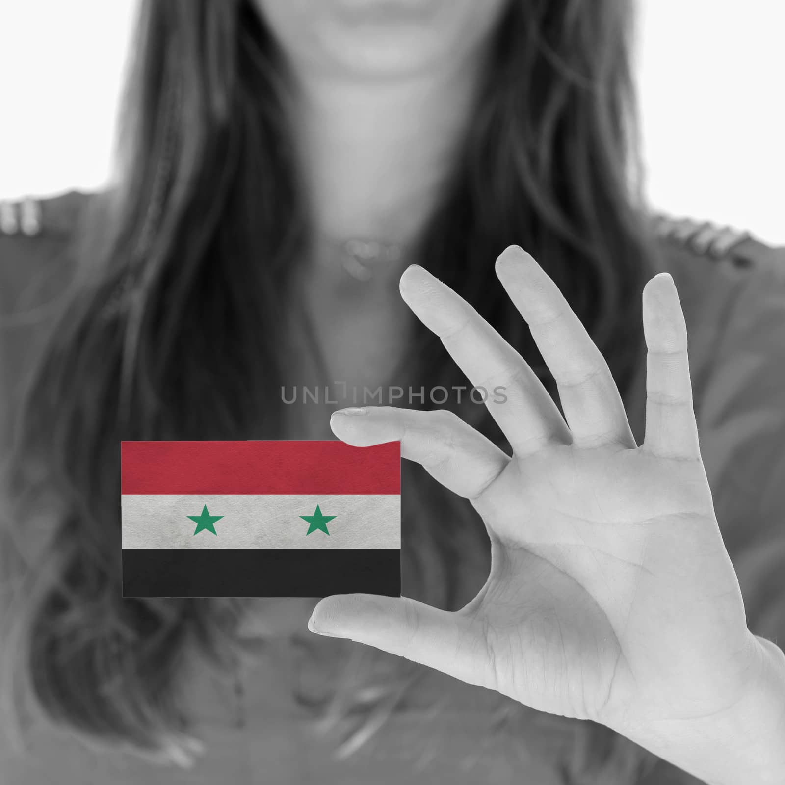 Woman in showing a business card, Syria