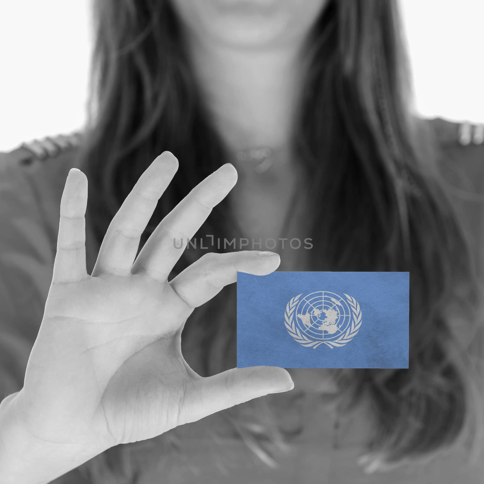 Woman in showing a business card, United Nations