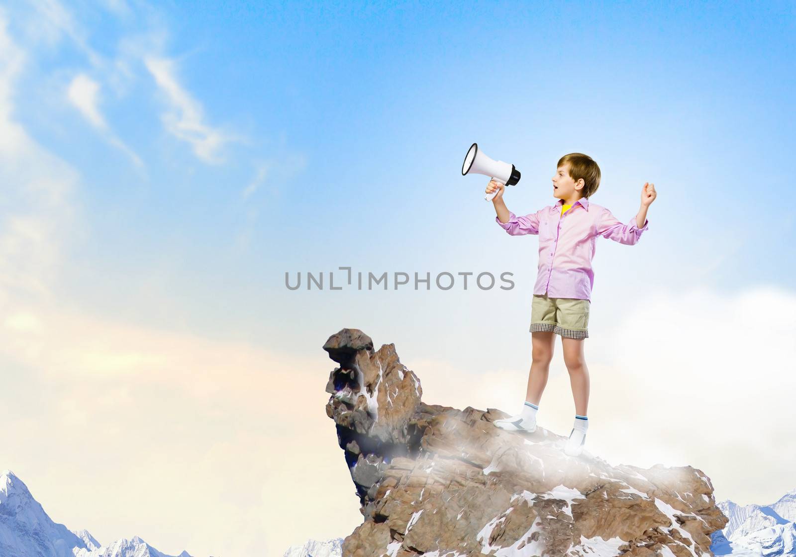 Image of little cute boy shouting in megaphone