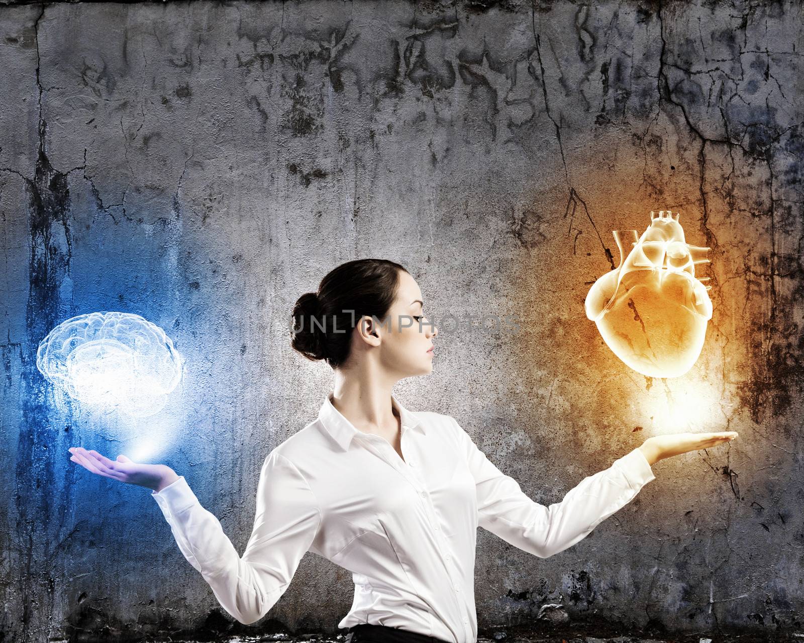 Image of businesswoman balancing with items in palms