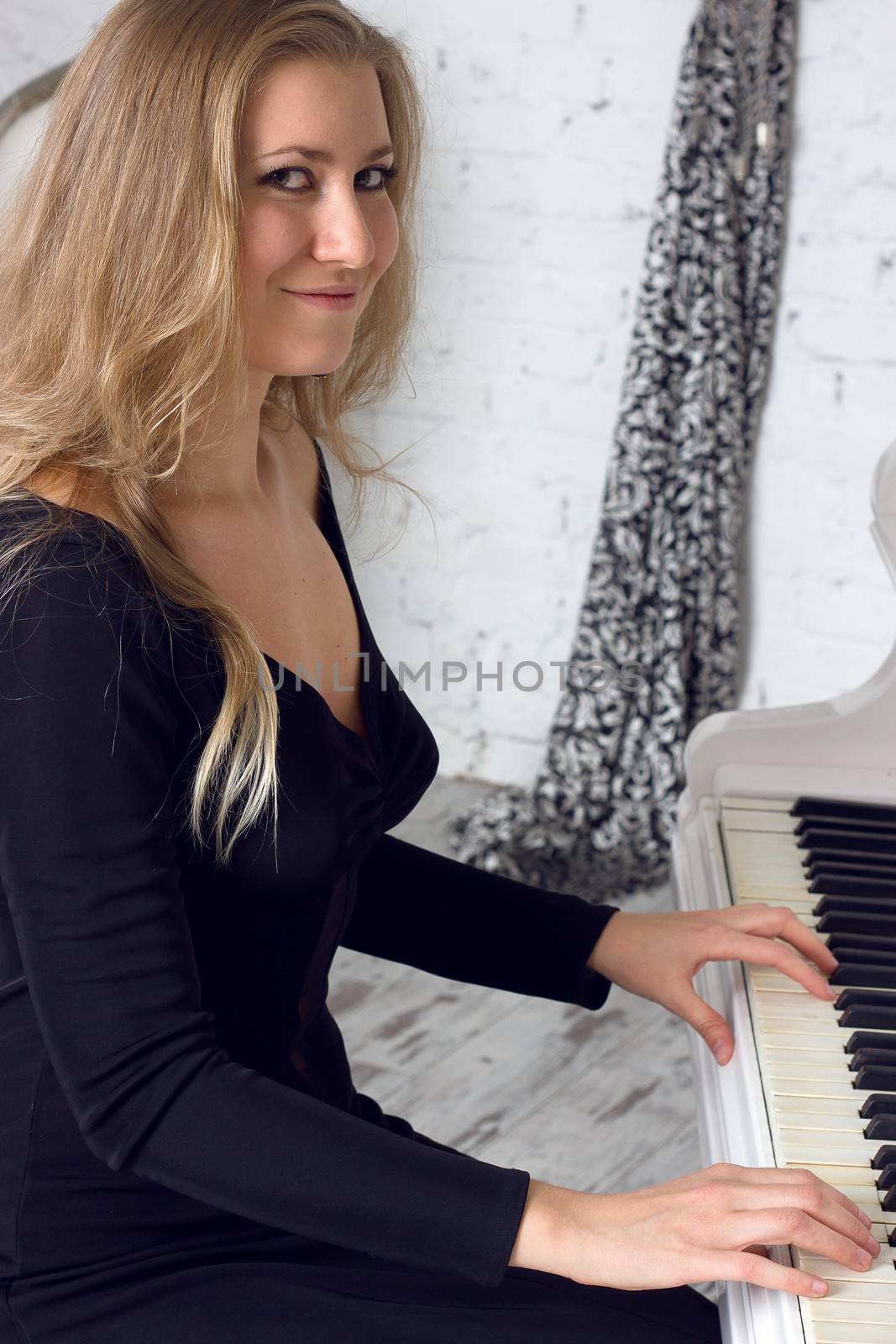 Beautiful middle eastern girl playing piano