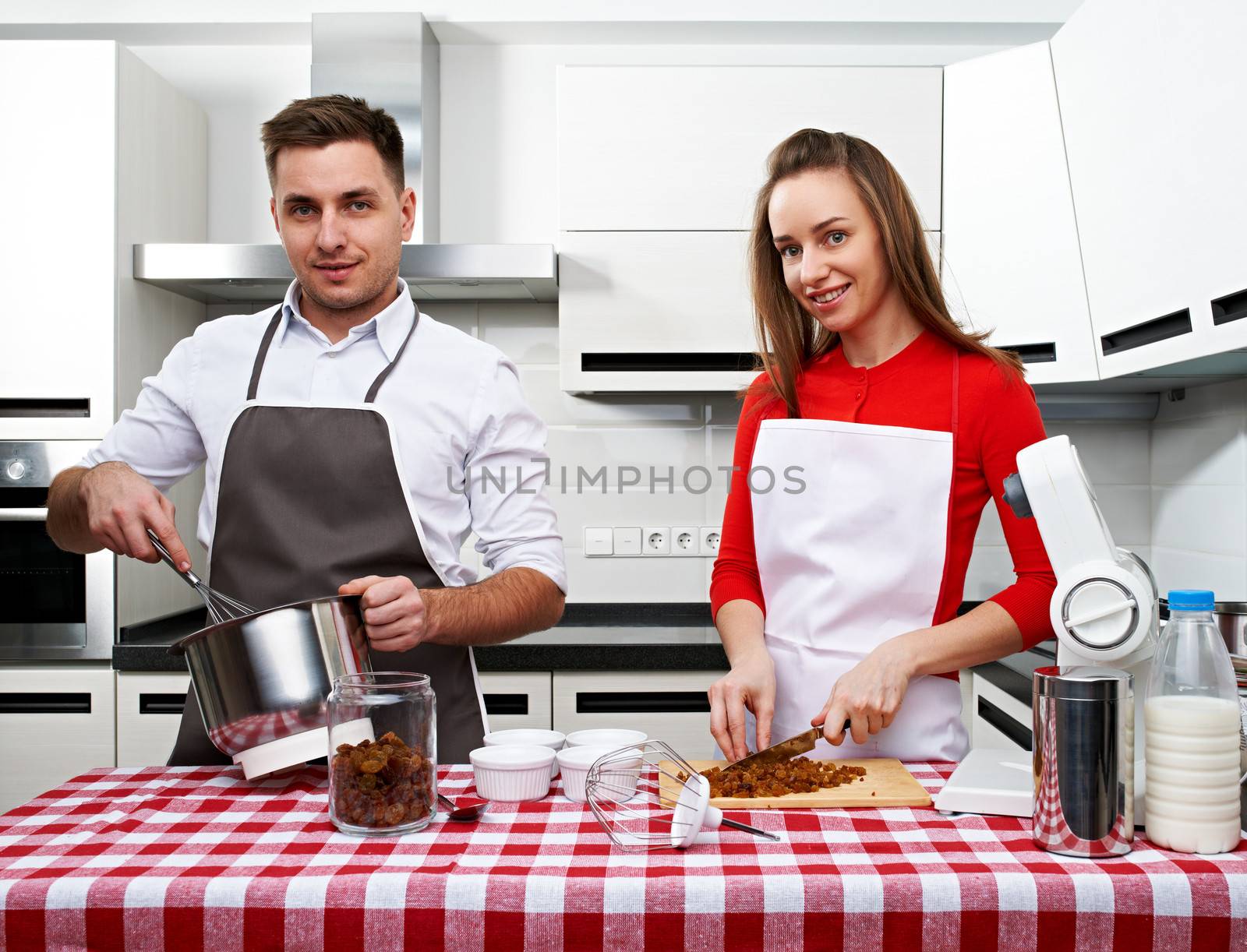 Couple at kitchen cooking together