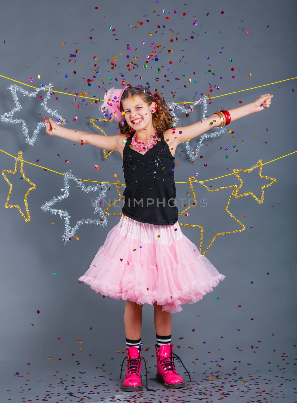 Fashion girl is wearing masquerade costume. Holiday theme/Emotion child.
