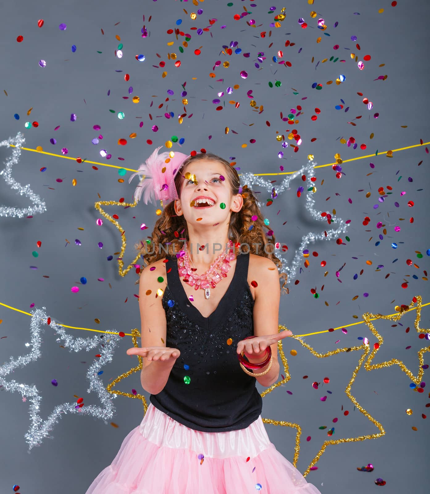 Fashion girl is wearing masquerade costume. Holiday theme/Emotion child.