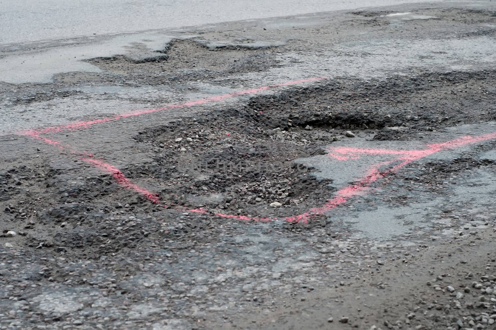 Shot of big potholes on the road