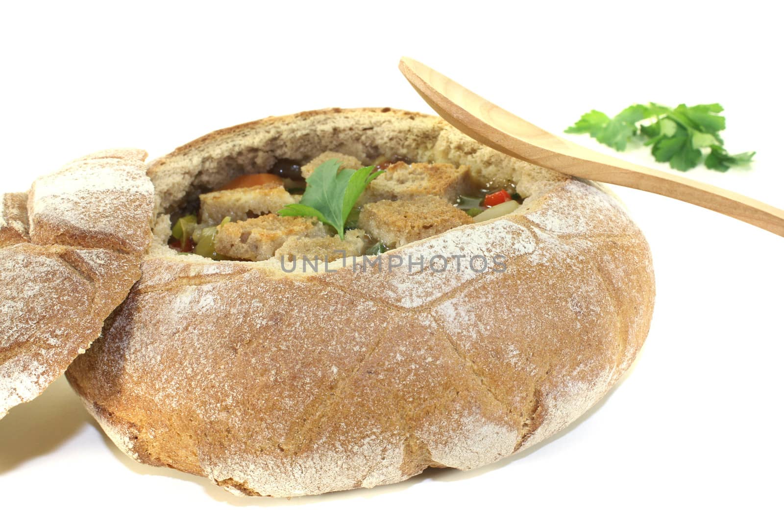 Bread soup with greens on a light background