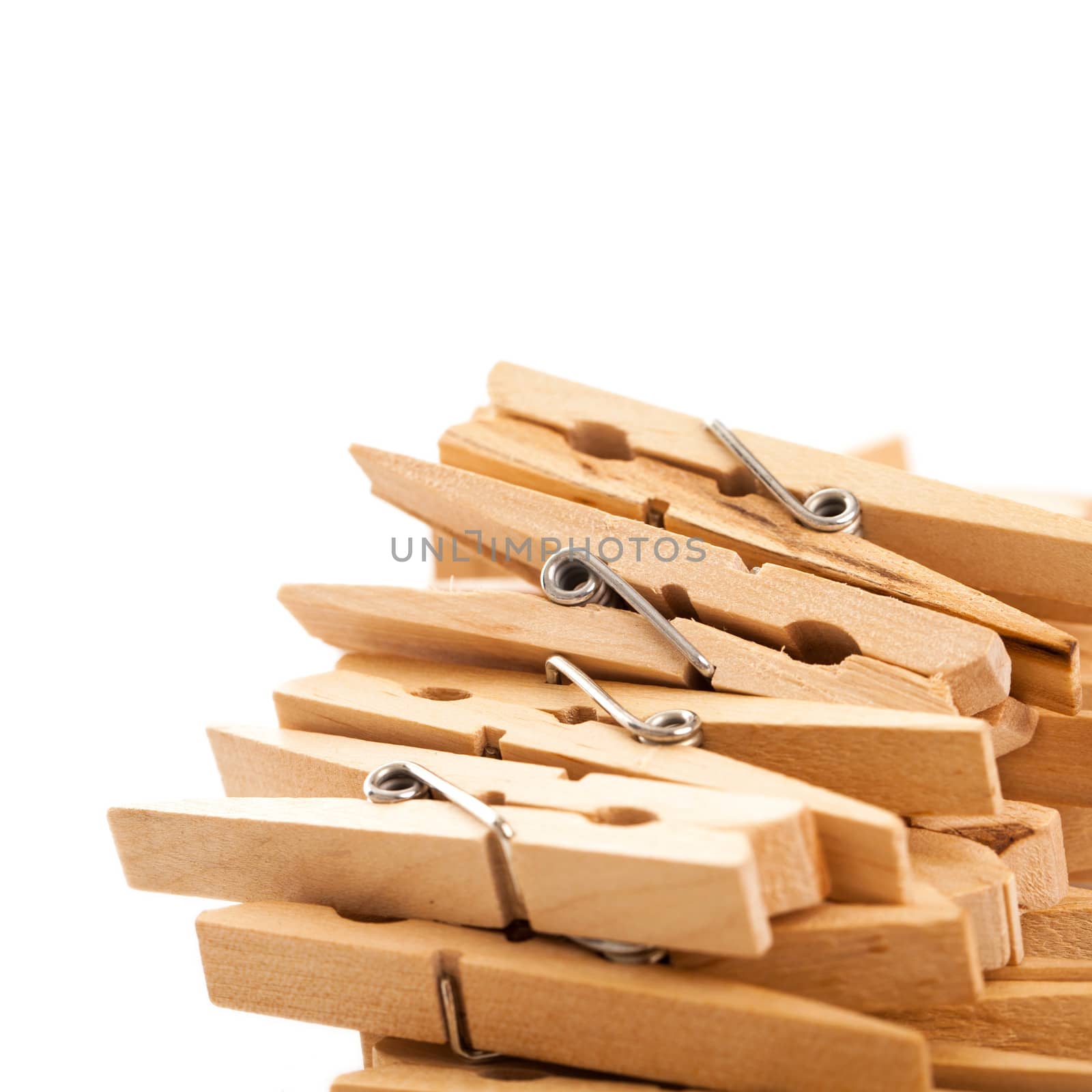 Closeup image of eco wooden clothespins on a white background