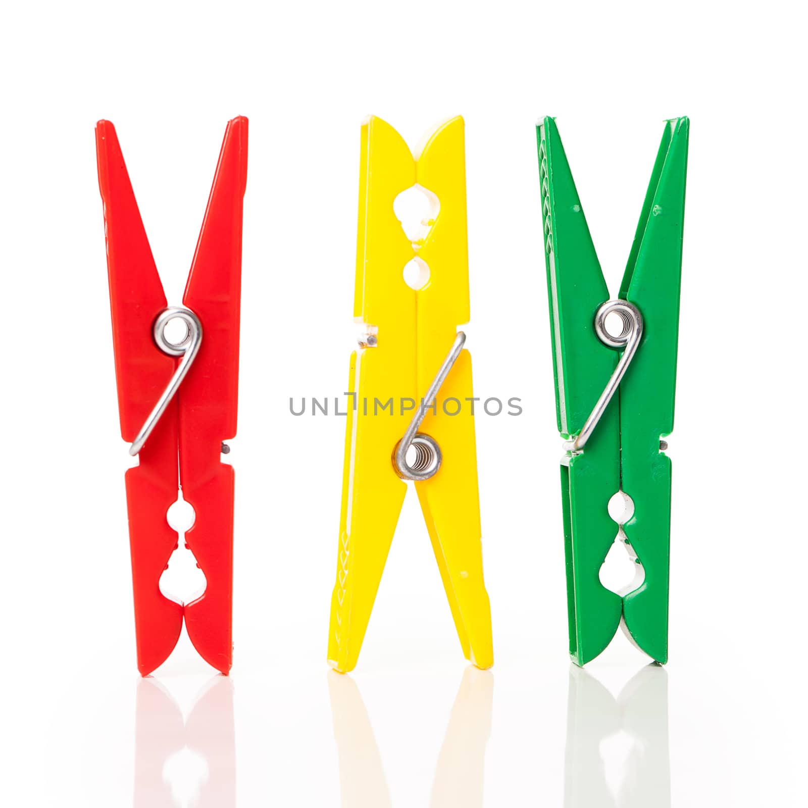 Closeup image of colorful clothespins isolated on a white background