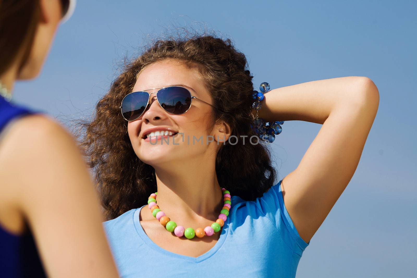 Attractive young women having fun outdoors. Summer vacation