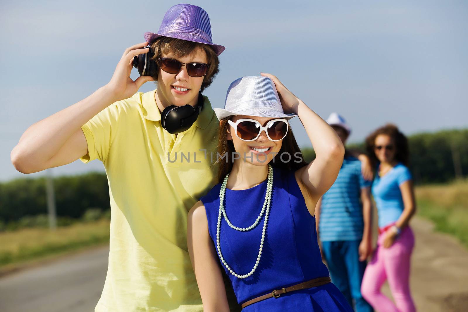 Young man and young woman outdoors. Summer vacation