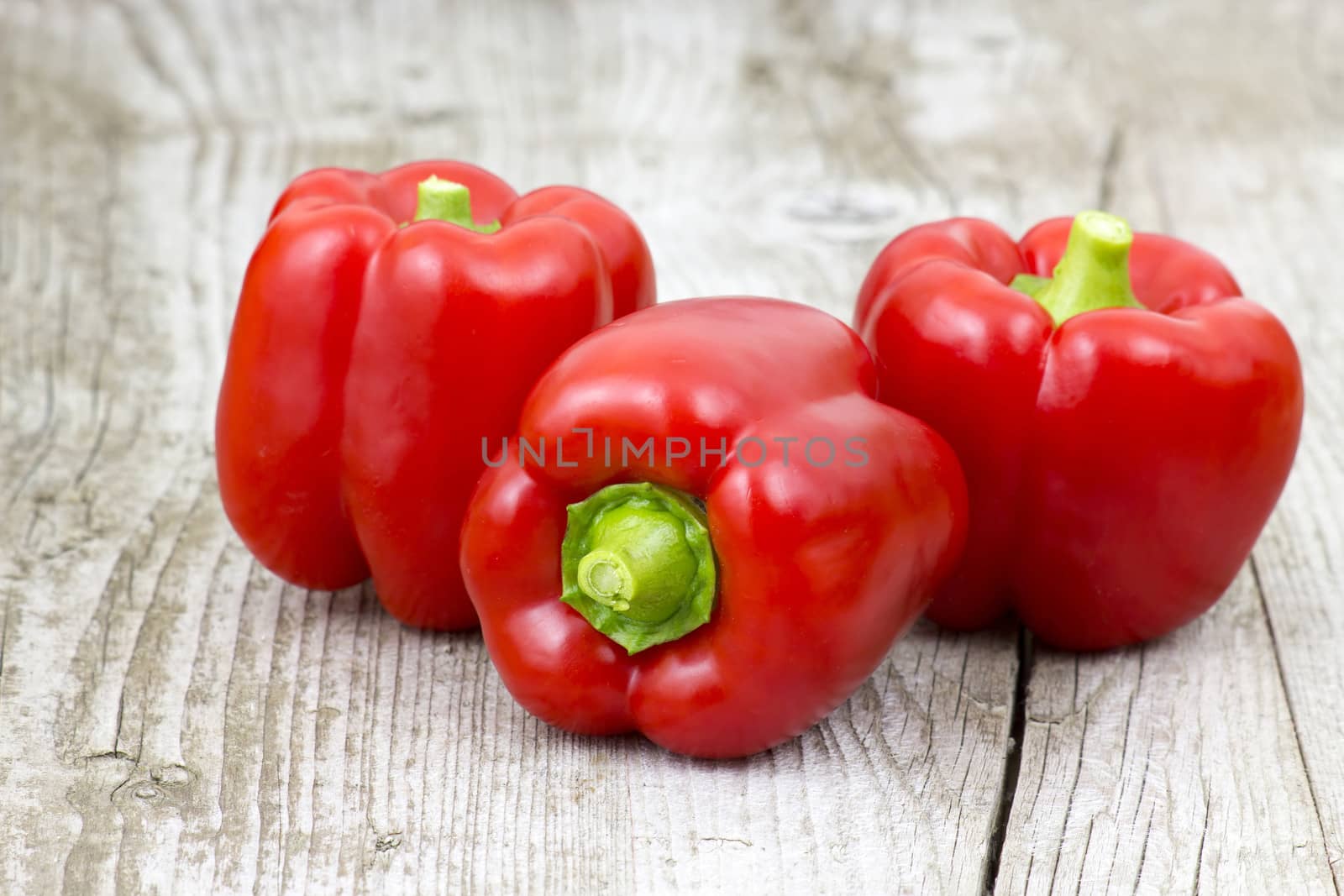 red peppers on wooden background