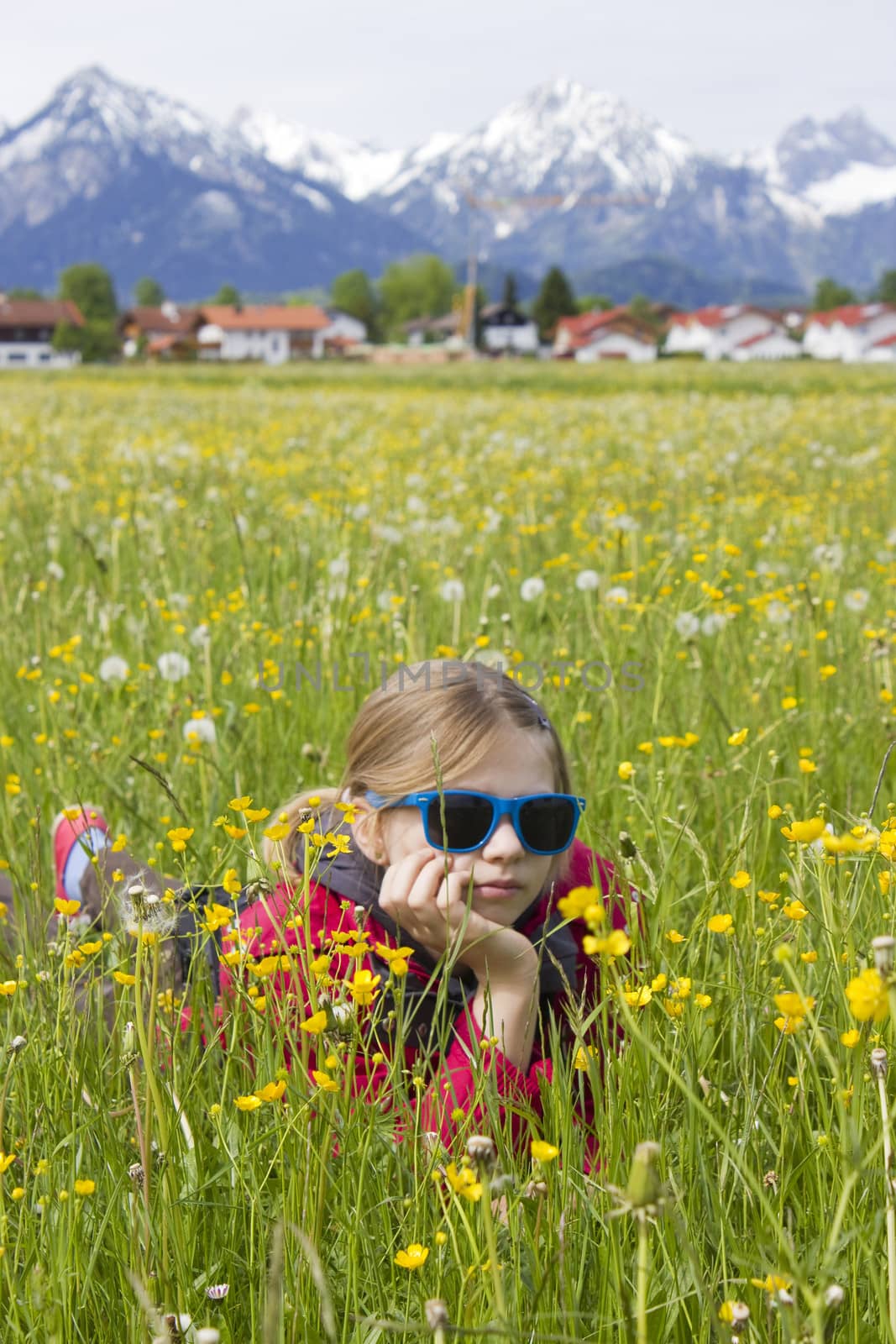 portrait of a girl against the panorama of the Alps