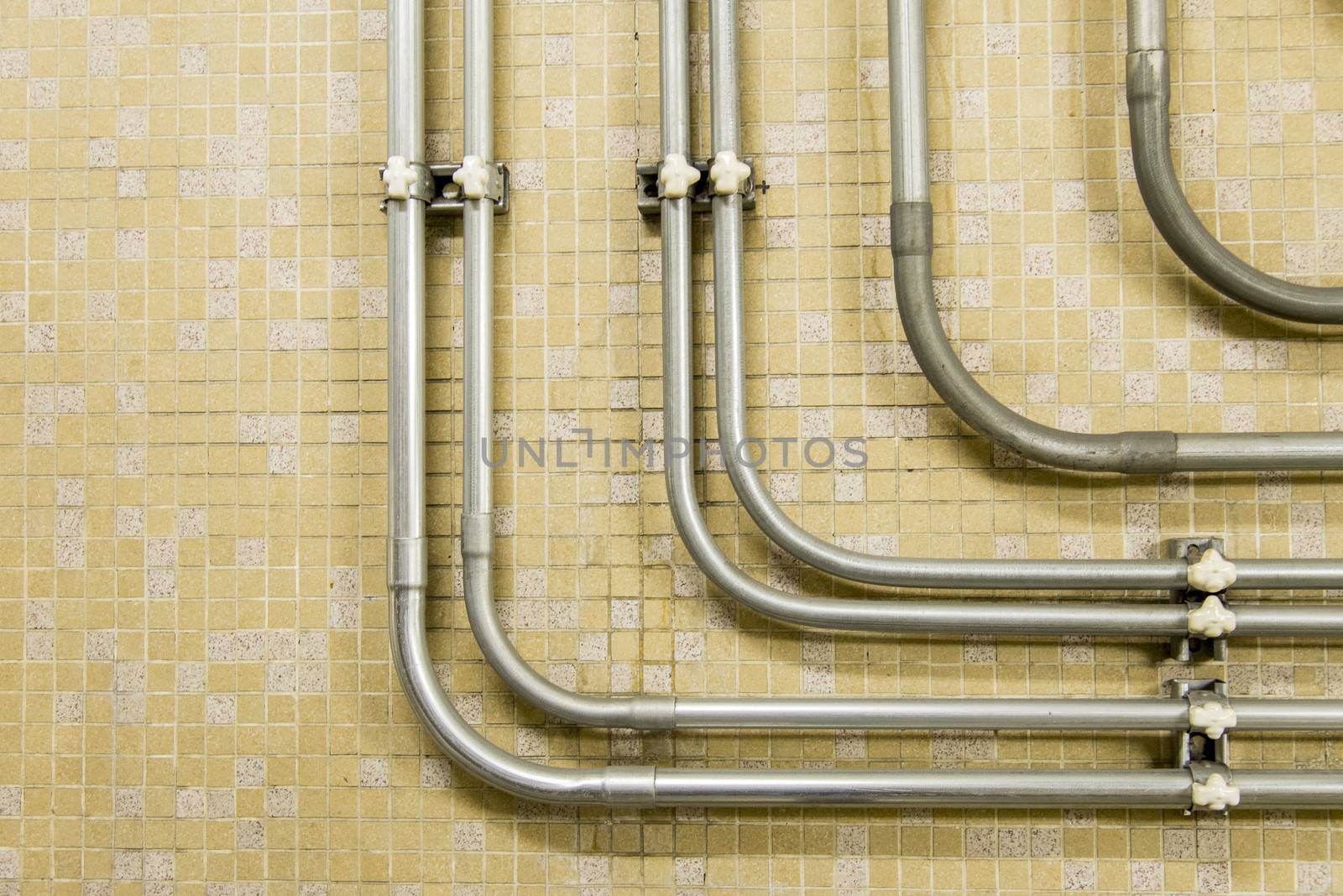 Piping connector on the wall by gjeerawut