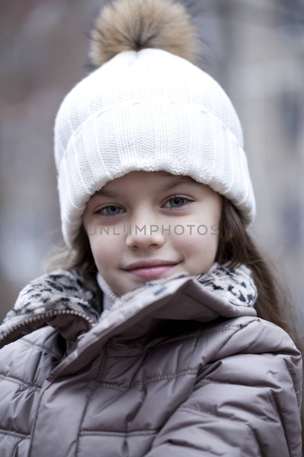 Little girl in a white knitted hat autumn by andersonrise