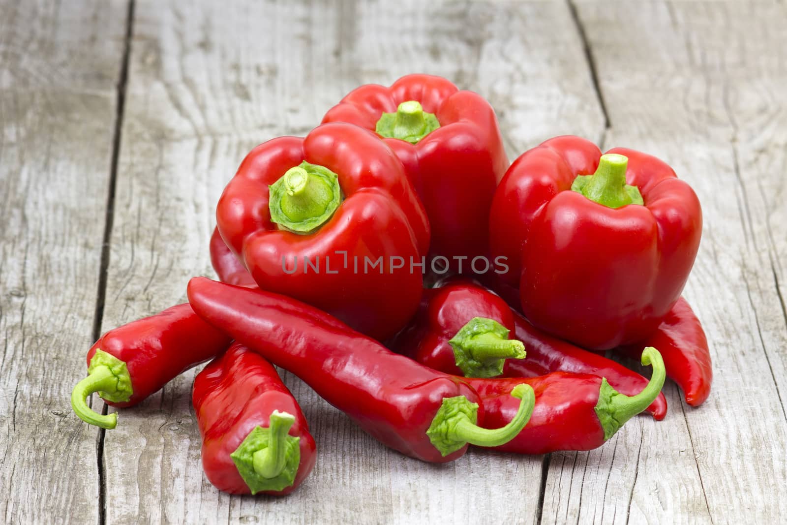 red peppers on wooden background