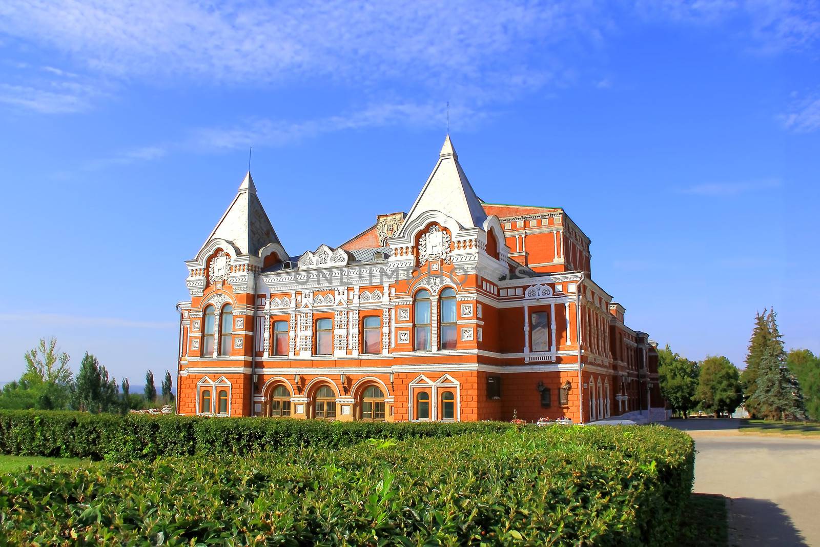 Town landscape with historic theater and blue sky