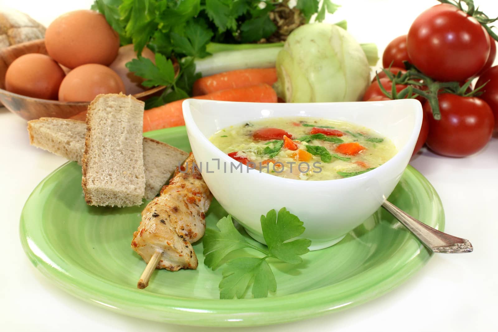 a chicken soup with egg and parsley