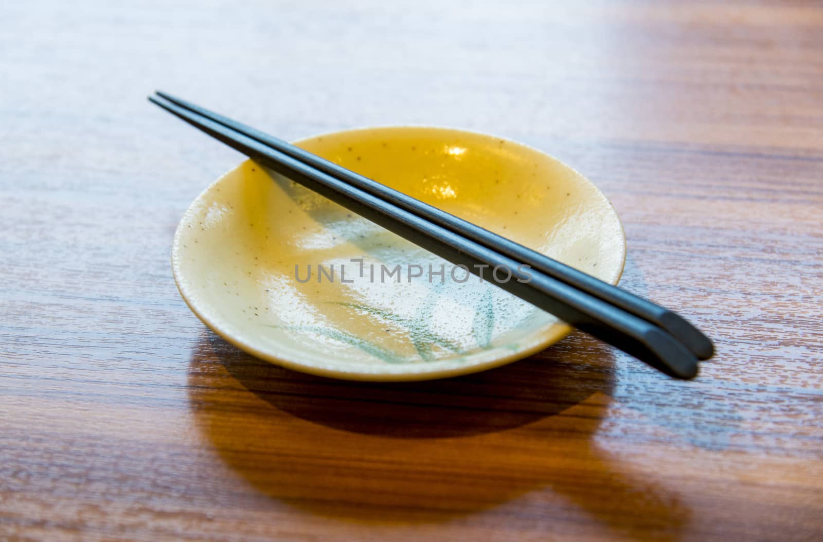 Ceramic bowl and chopsticks2 by gjeerawut