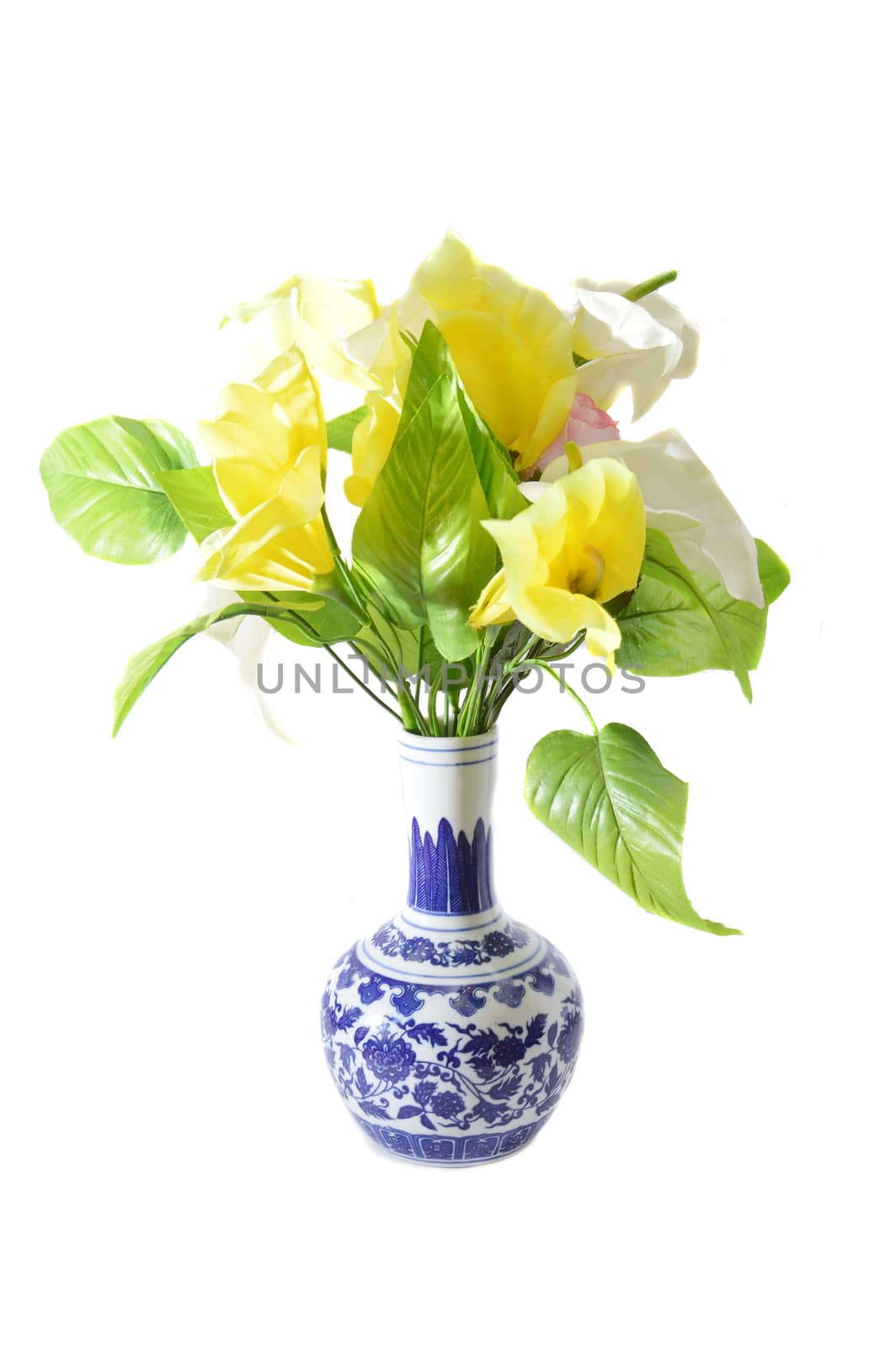 artificial flower on a porcelain vase isolated on white background