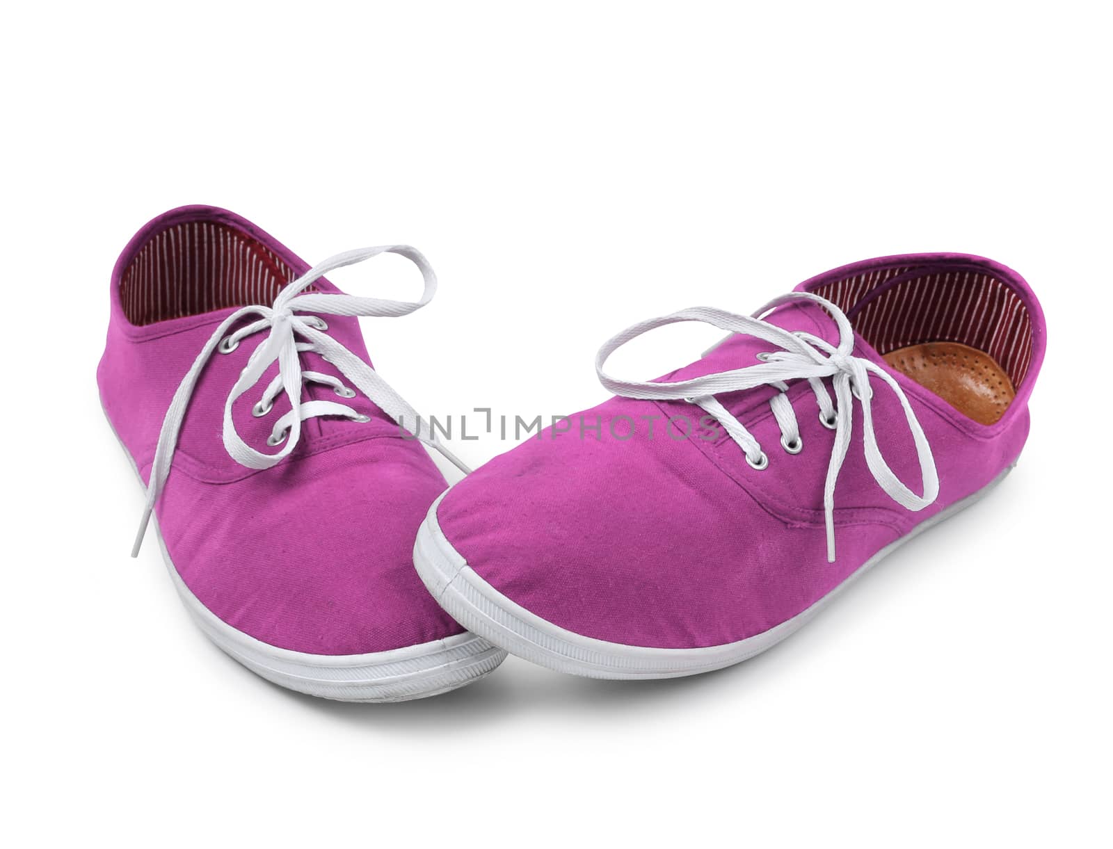 Shy pink sneakers isolated on white, shyness concept