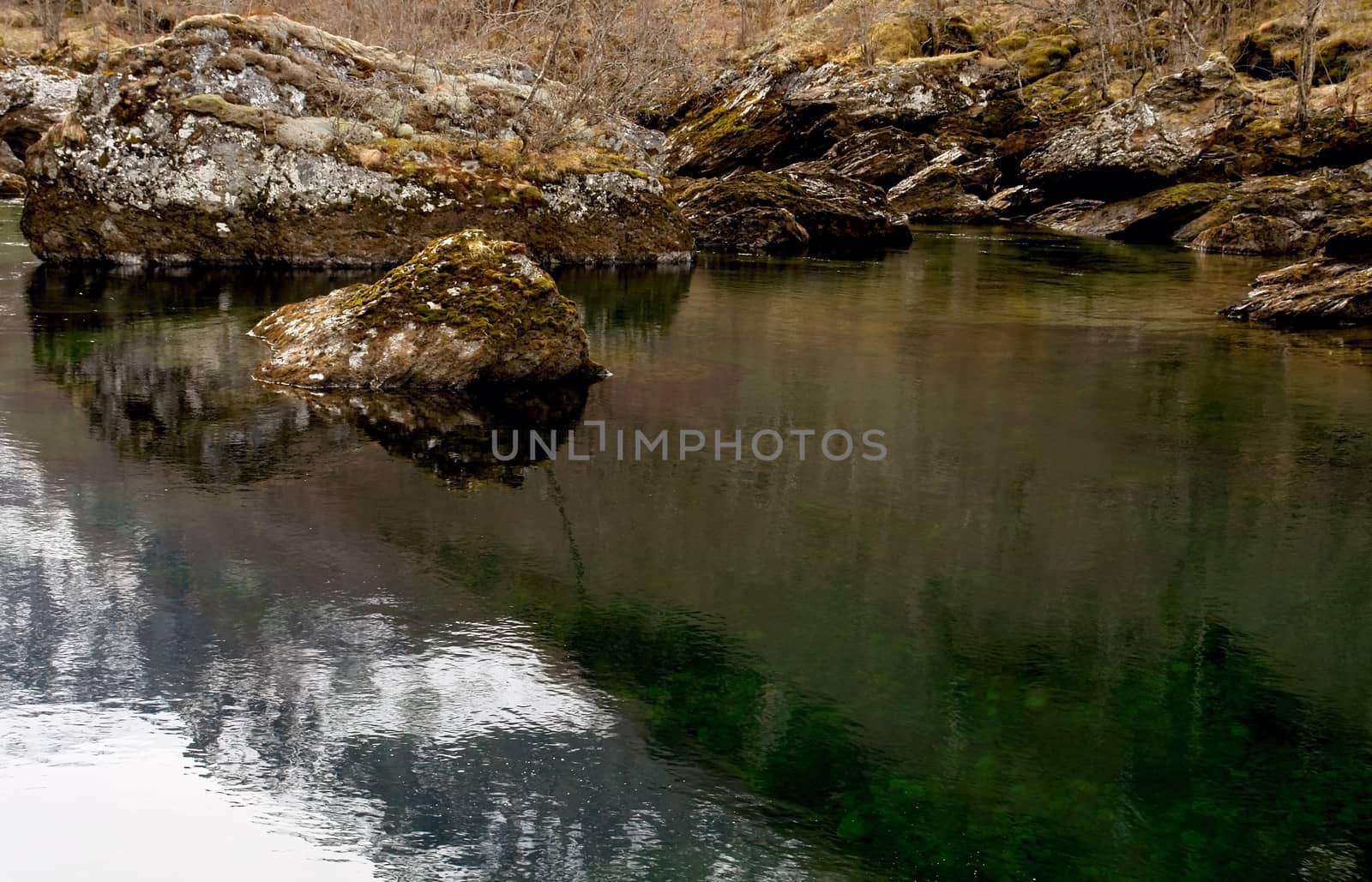 River calm streem in winter rocky lanscape, Norway