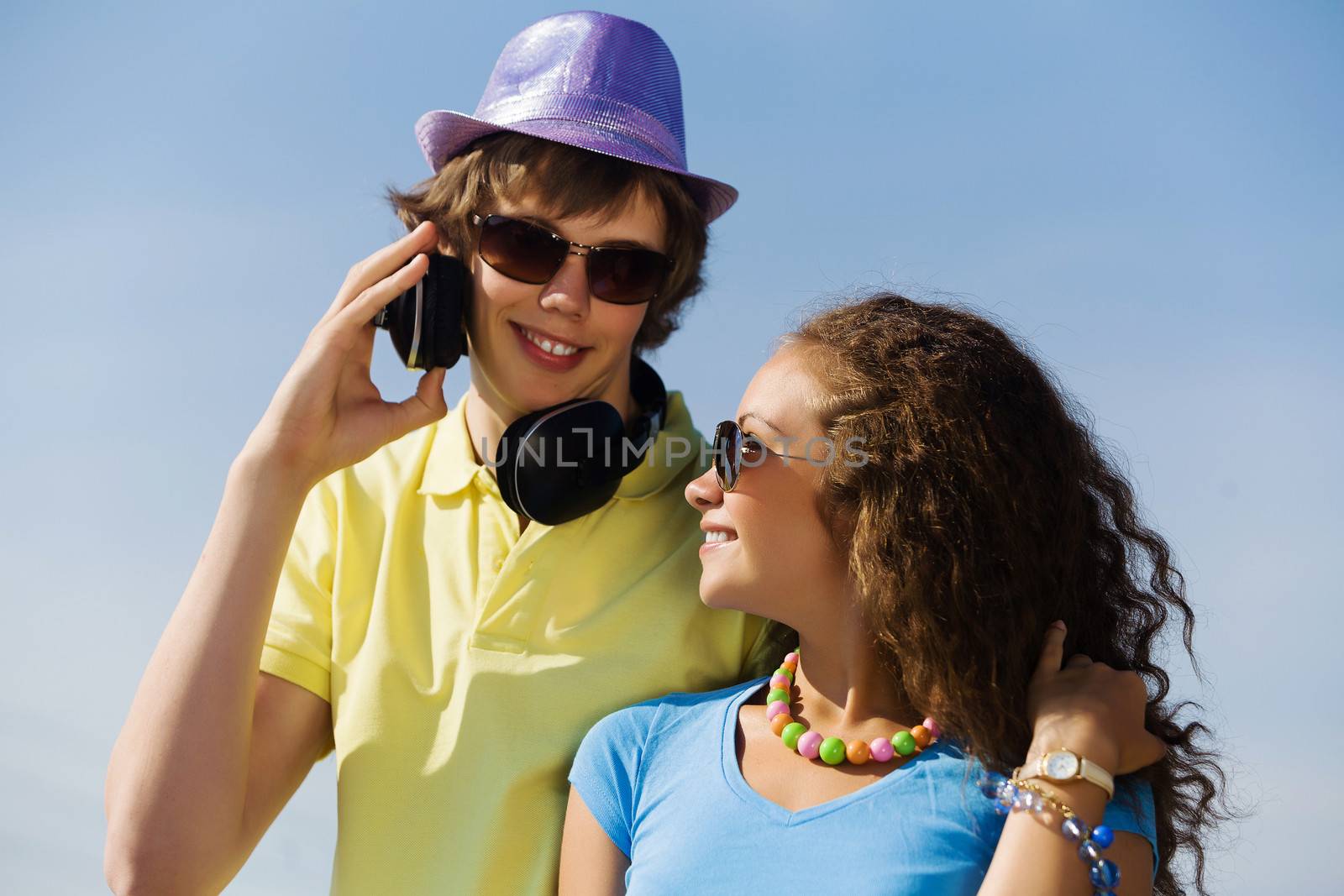 Young man and young woman outdoors. Summer vacation