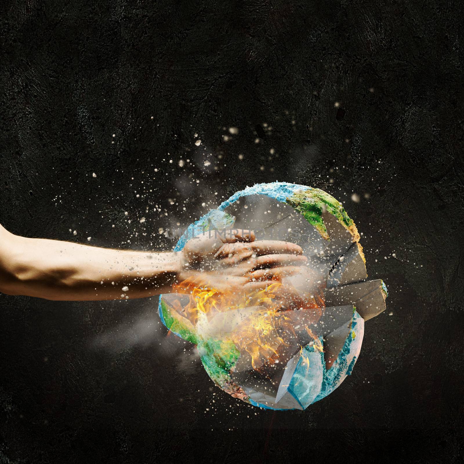 Close up image of human hand breaking earth planet