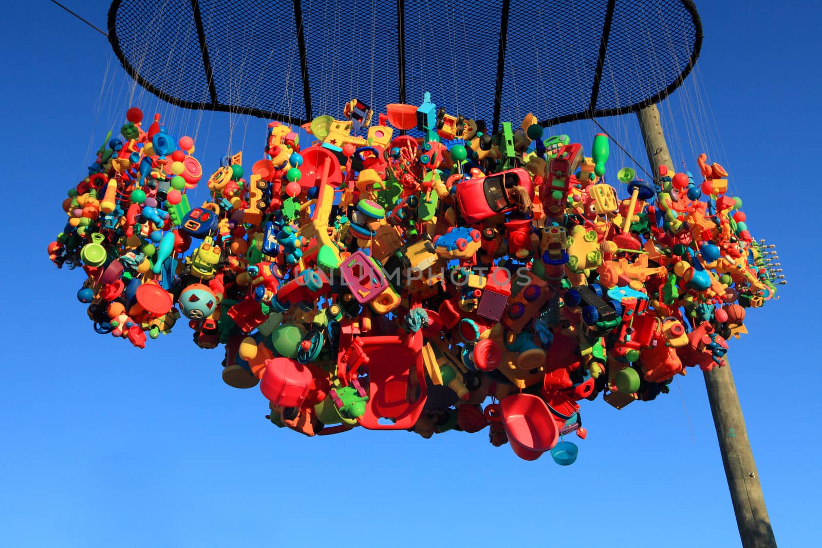 Bondi Beach, Australia - November 3,  2013: Sculpture By The Sea, Bondi 2013. Annual cultural event that showcases emerging artists from around the world  Sculpture titled 'Happy floating dream cloud' by Kathy Allam (WA).  Medium plastic, aluminium, nylon, polypropelene.  Price $9500