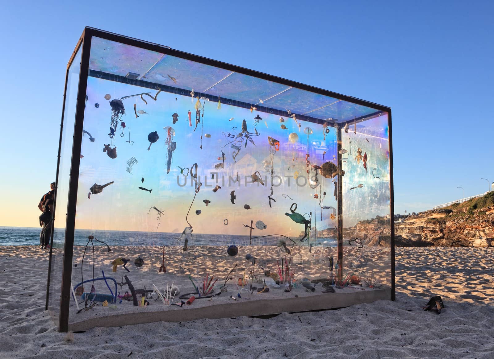 Bondi Beach, Australia - November 3,  2013: Sculpture By The Sea, Bondi 2013. Annual cultural event that showcases emerging artists from around the world  Sculpture titled Aquarium of the Pacific Gyre' by Marina DeBris (USA).  Medium Metal frame, actrylic sheets, rubbish from the beach.  Price $18000