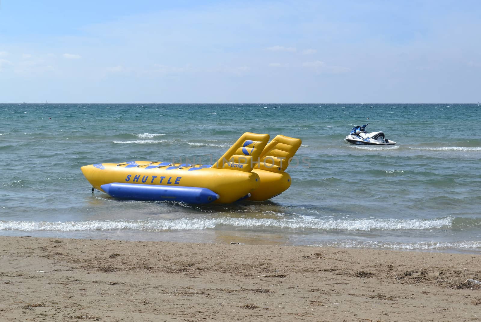 the attraction and hydrocycle stand on the sea coast.