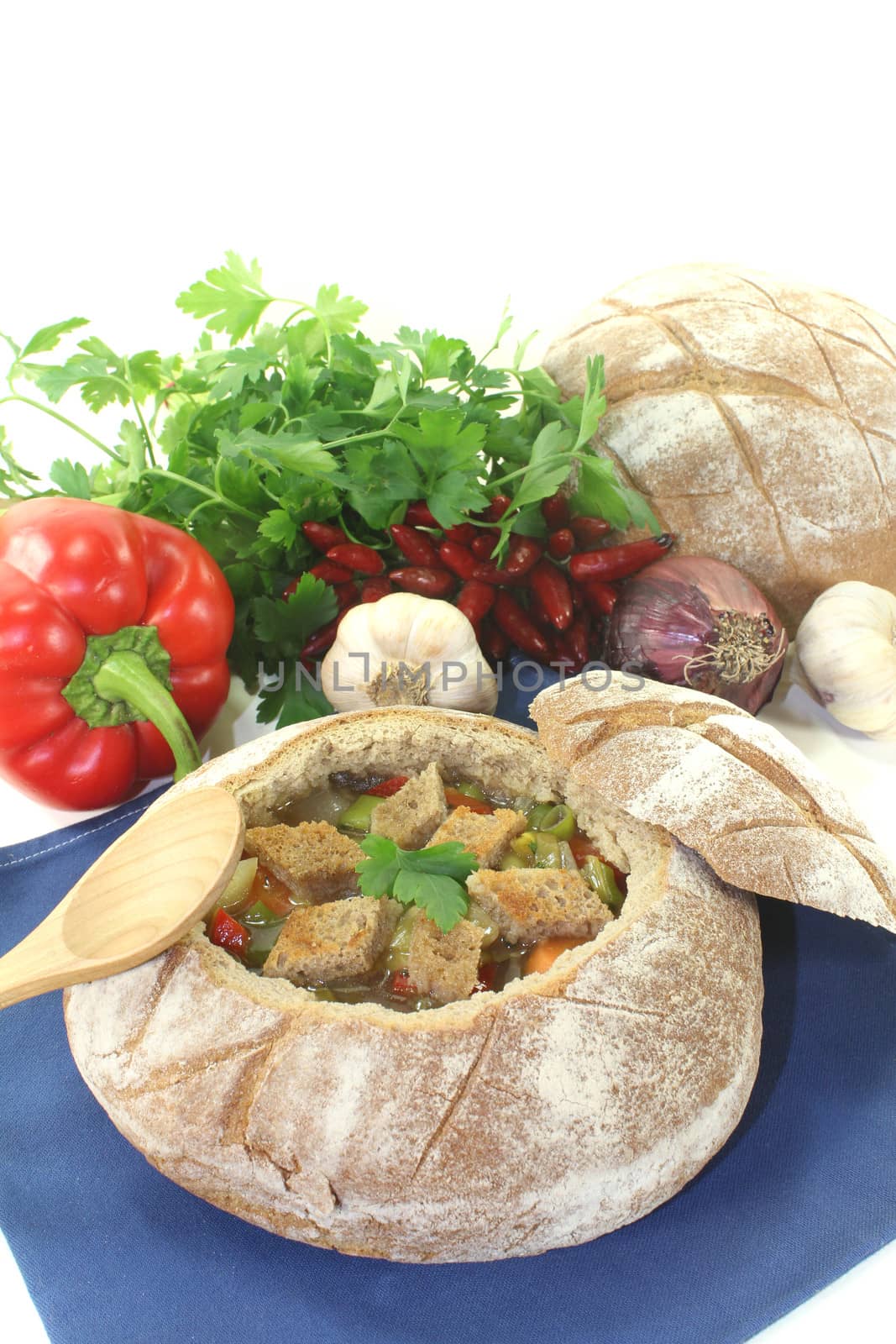Bread soup with bell pepper on a light background