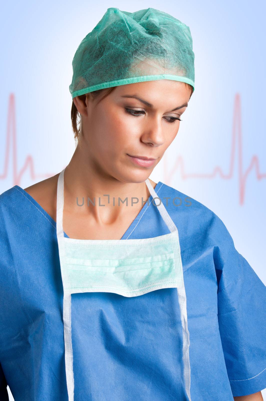 Sad Female Surgeon in scrubs, looking down, with an EKG graph behing her