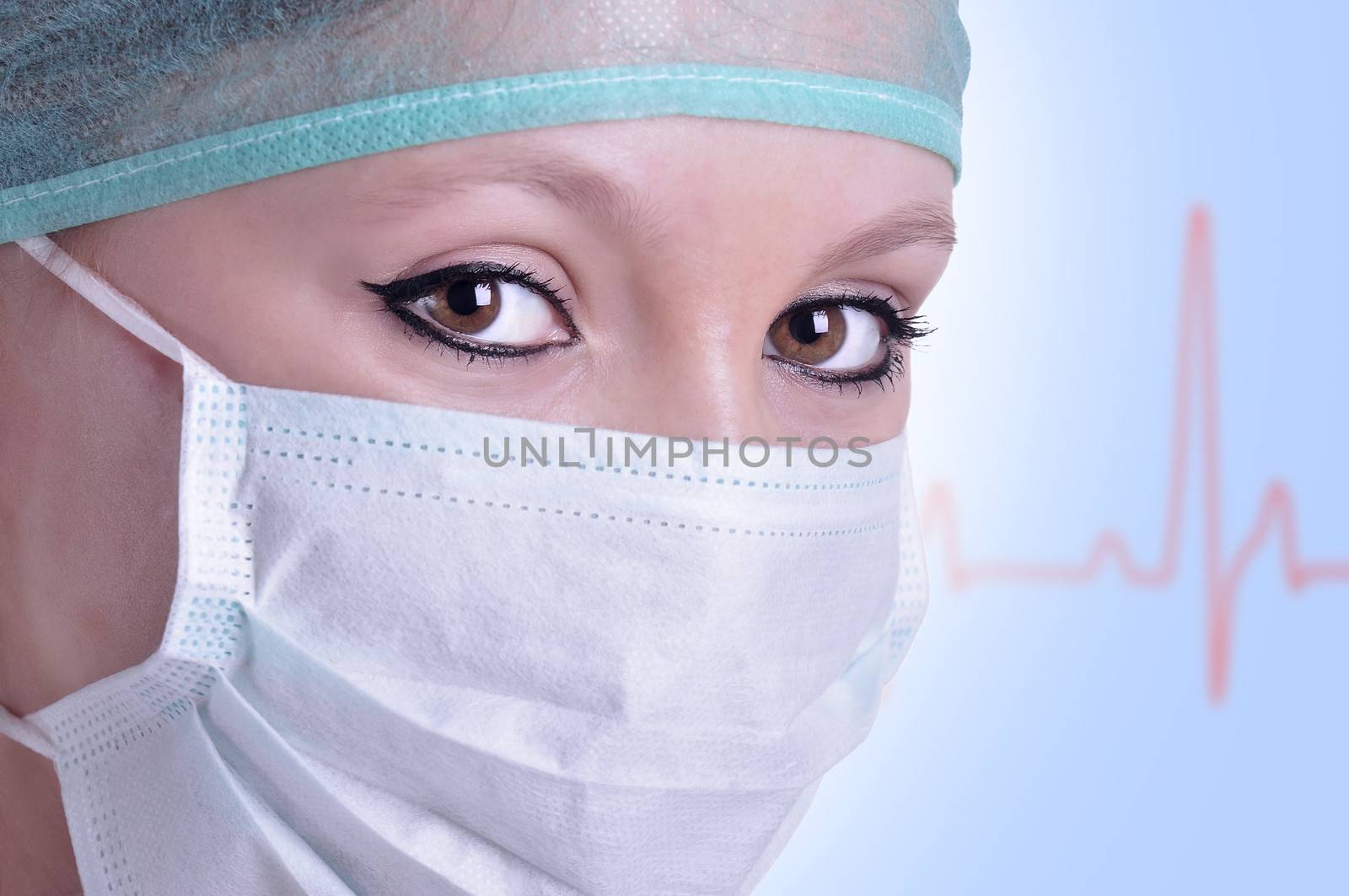 Closeup portrait of a female surgeon with an EKG graph behing her, with a blue color cast