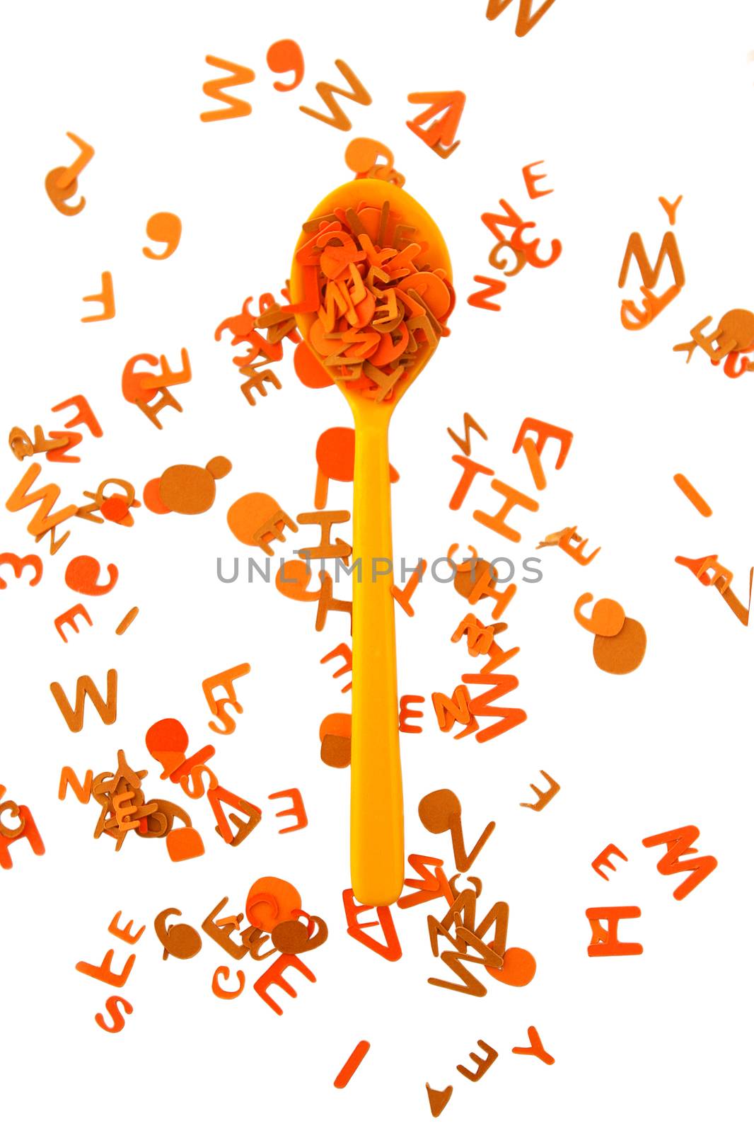 Yellow and orange spoon alphabet on a white background