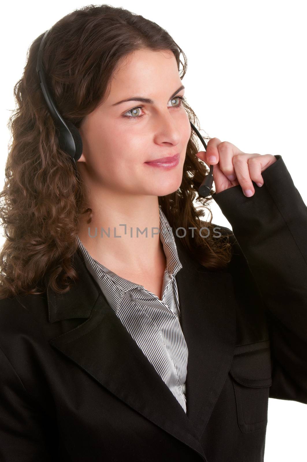 Corporate woman talking over her headset, isolated in a white background