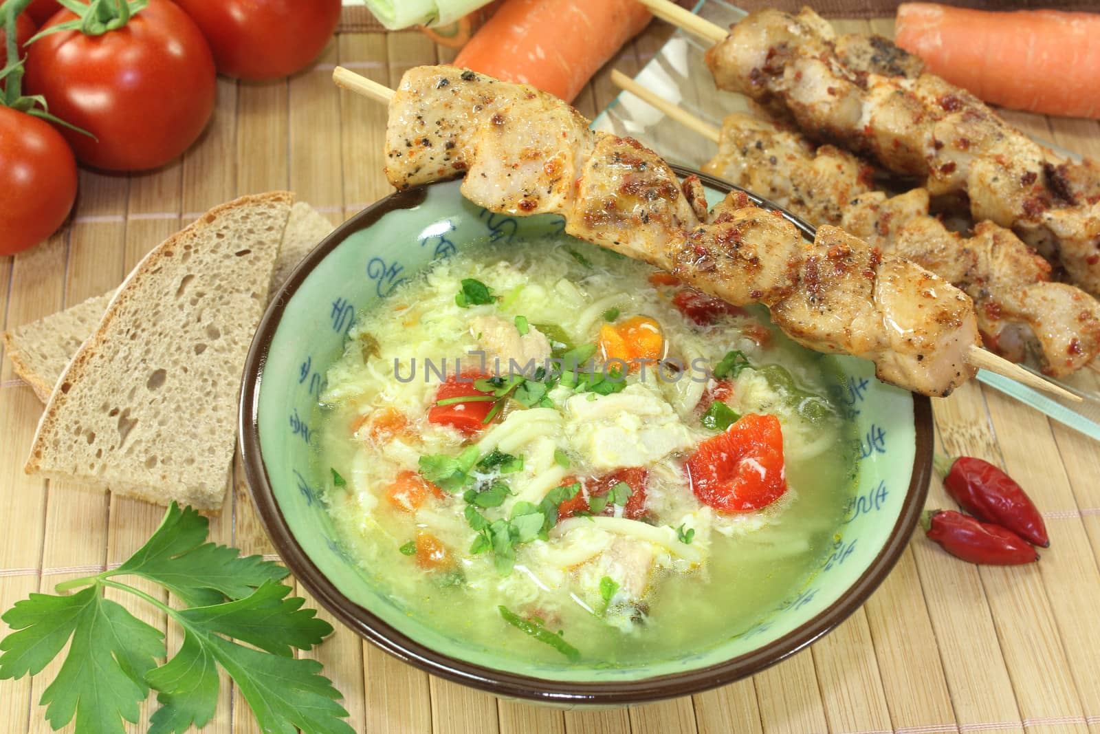 a chicken soup with egg and parsley