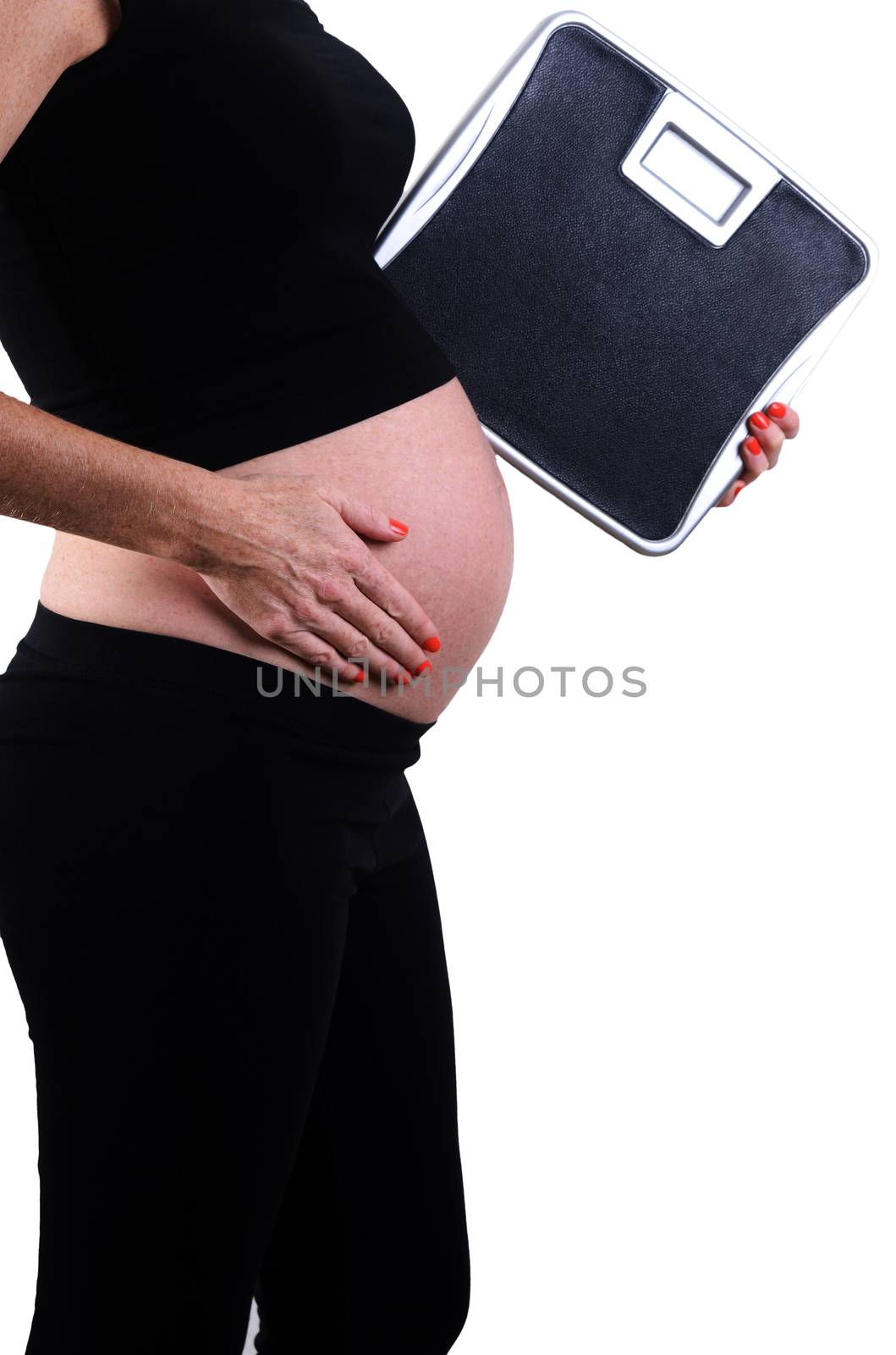 healthy weight gain during pregnancy with expectant mother holding scale
