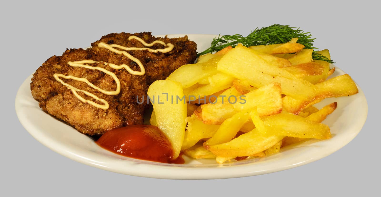 French fries with chicken chops on the white plate. Isolaten on the gray background.