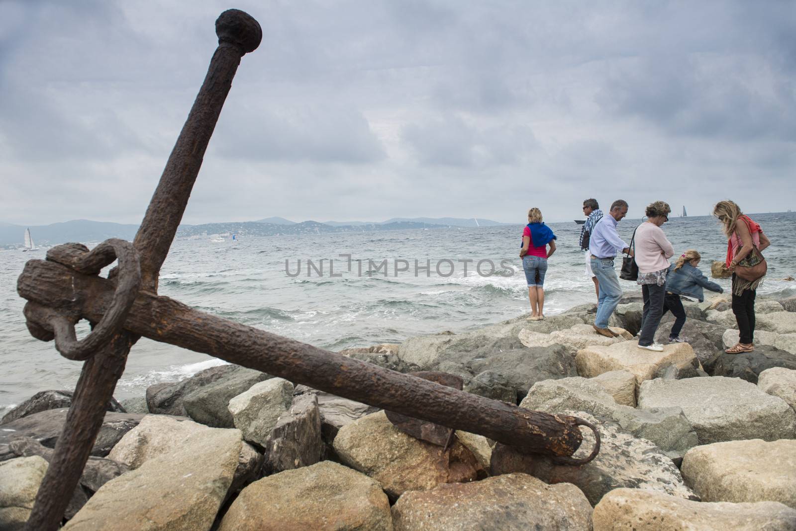 Tourists on Embankment in Saint-Tropez in autumn day