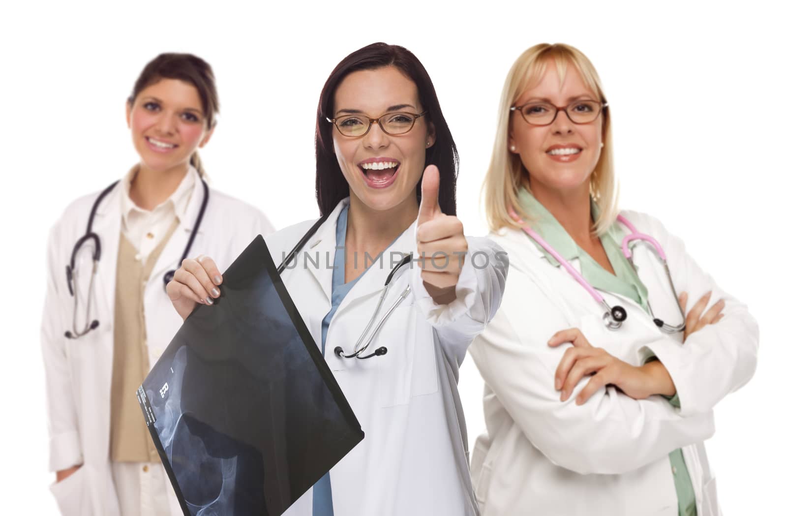 Three Mixed Race Female Doctors or Nurses with Thumbs Up Holding X-ray Isolated on White.