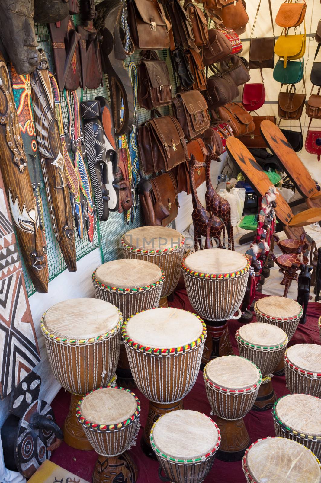 African crafts on a tightly packed traditional market stall