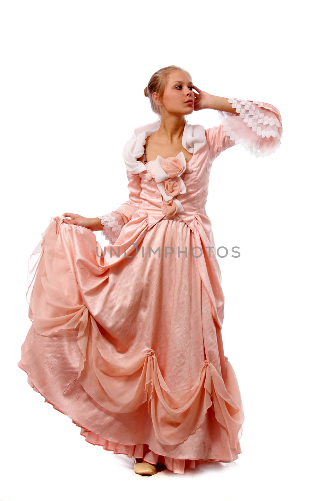 Full length of a beautiful young lady in dress standing against isolated white background