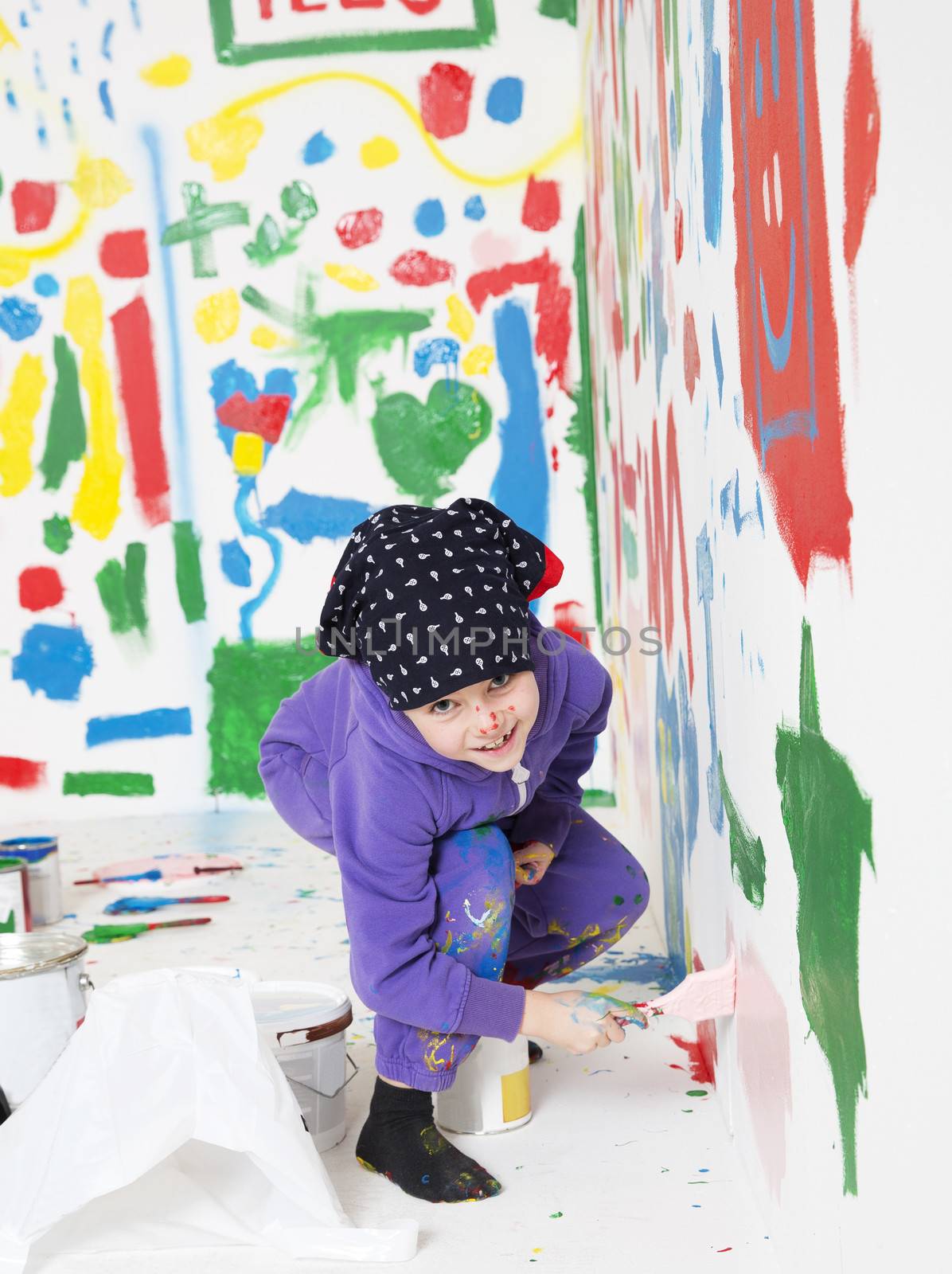 Young Artist painting with a smile on her face